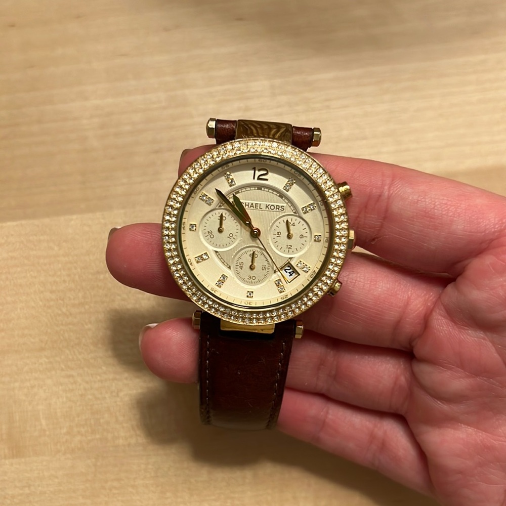 Leather band and gold face with Diamond ring